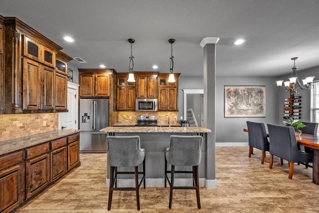 kitchen featuring stainless steel appliances, recessed lighting, visible vents, and tasteful backsplash