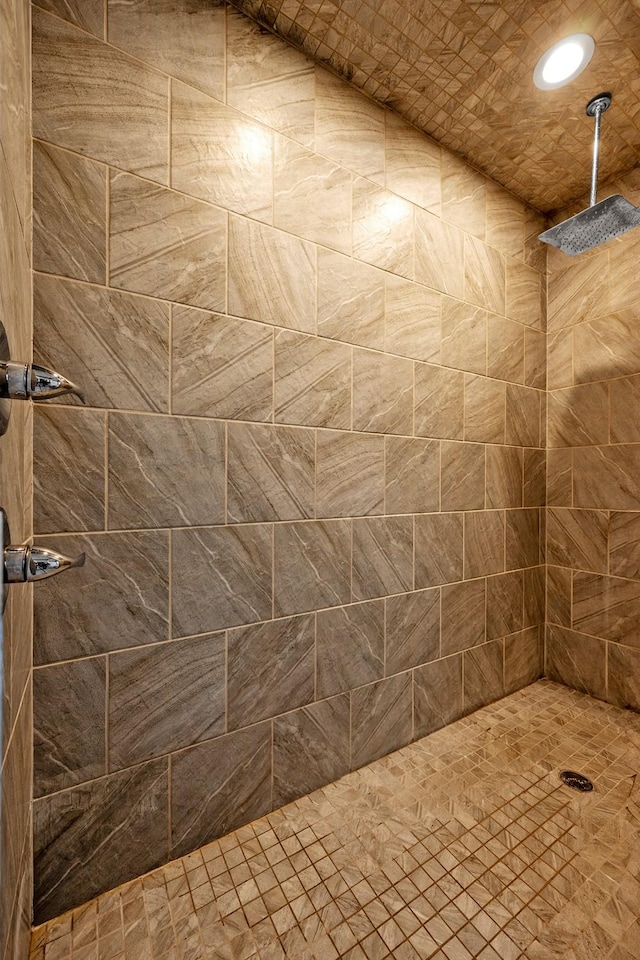 bathroom with a tile shower