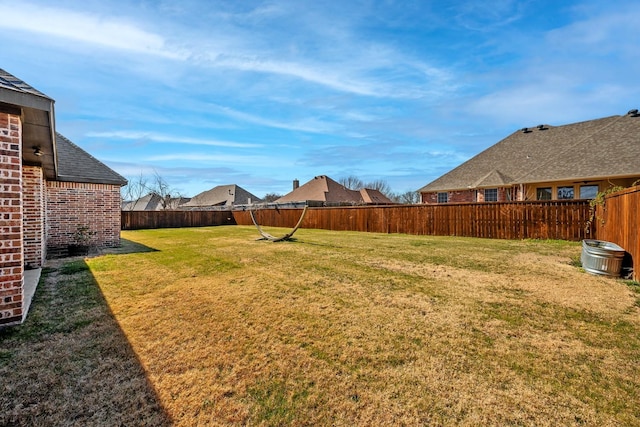 view of yard featuring a fenced backyard