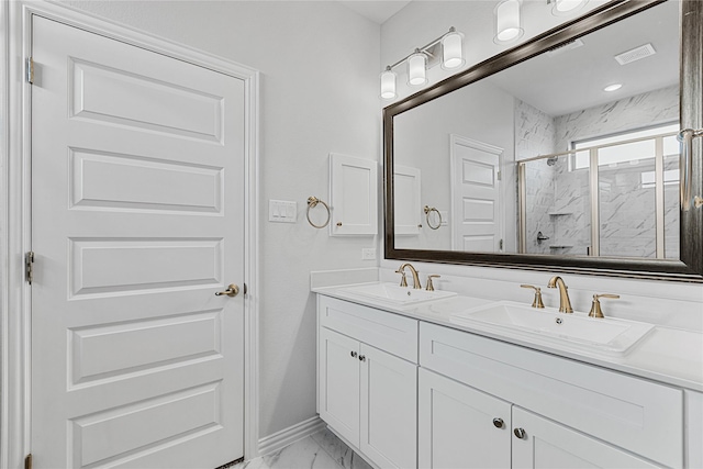 bathroom with marble finish floor, double vanity, a sink, and a marble finish shower