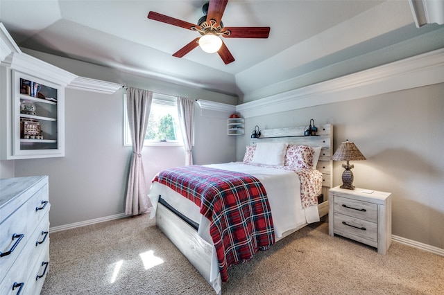 bedroom with lofted ceiling, light colored carpet, ceiling fan, and baseboards