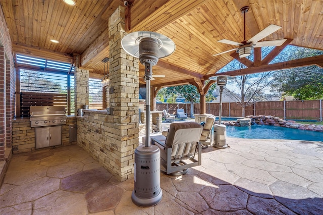 view of patio / terrace with ceiling fan, a fenced backyard, exterior kitchen, grilling area, and a fenced in pool