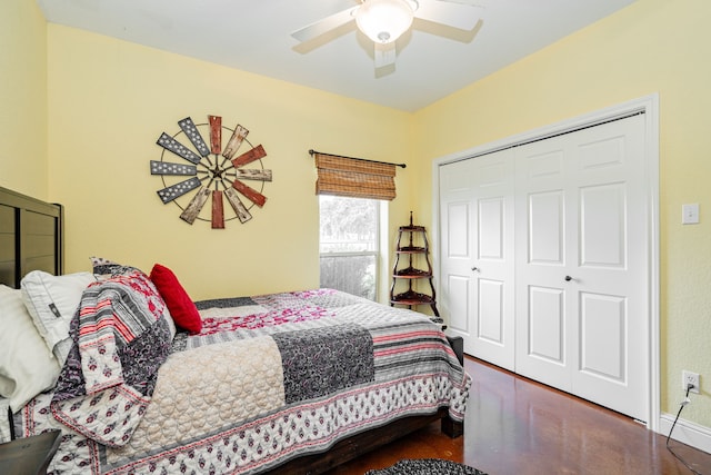 bedroom with ceiling fan, baseboards, and a closet