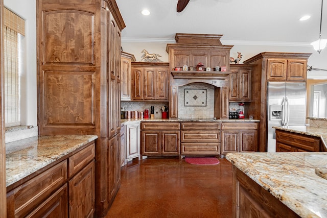 kitchen with recessed lighting, backsplash, ornamental molding, stainless steel fridge, and concrete floors