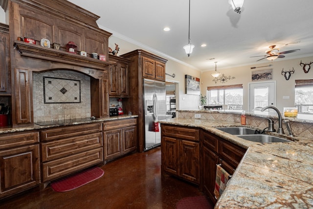 kitchen with stainless steel refrigerator with ice dispenser, a sink, and decorative backsplash