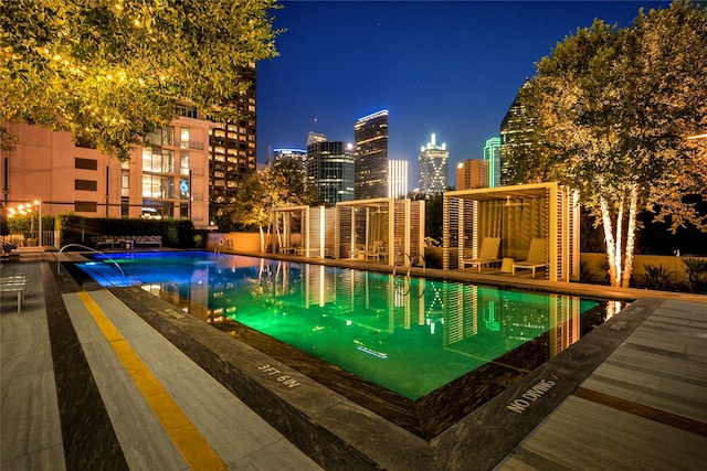 pool at twilight with a community pool