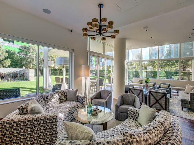 sunroom with a chandelier and plenty of natural light