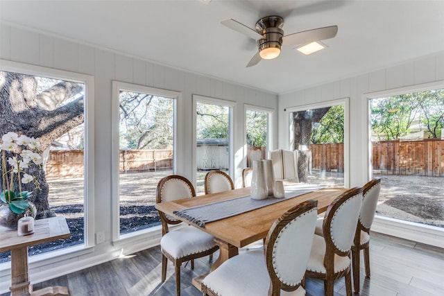 sunroom featuring ceiling fan