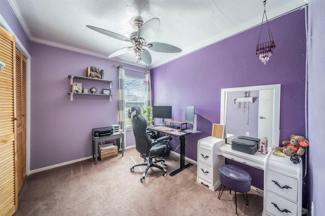 office with a textured ceiling, a ceiling fan, baseboards, carpet, and crown molding