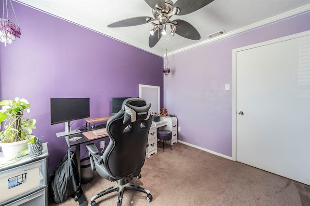 carpeted home office featuring visible vents, crown molding, baseboards, and ceiling fan