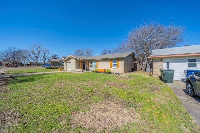 single story home with a front lawn, driveway, and an attached garage