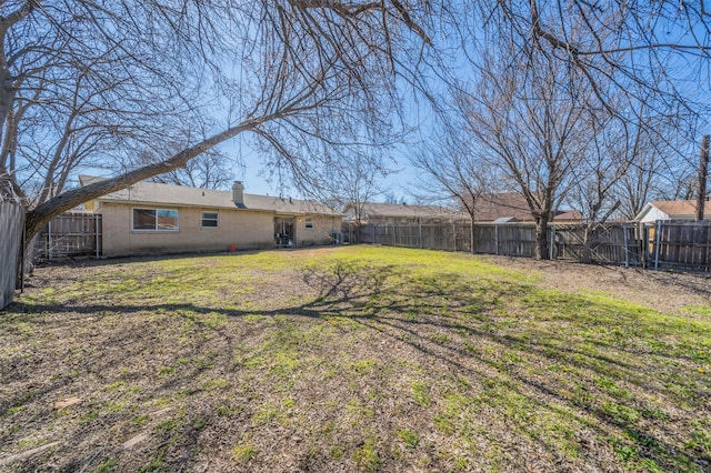 view of yard featuring a fenced backyard