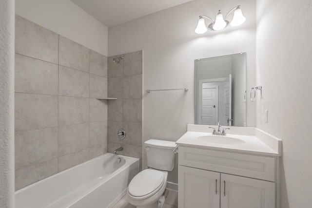 bathroom featuring bathtub / shower combination, vanity, and toilet