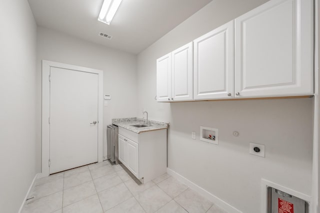 laundry area with cabinet space, visible vents, hookup for an electric dryer, a sink, and gas dryer hookup