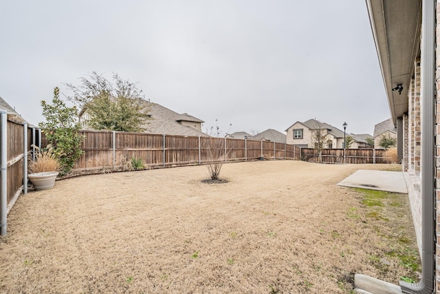 view of yard featuring a fenced backyard and a patio