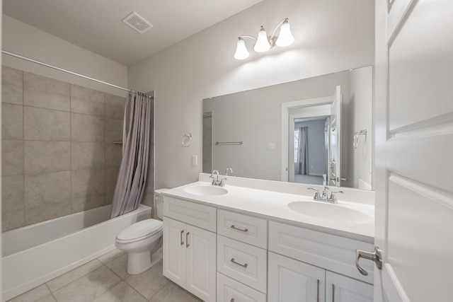 full bath with shower / bath combo, tile patterned flooring, a sink, and visible vents