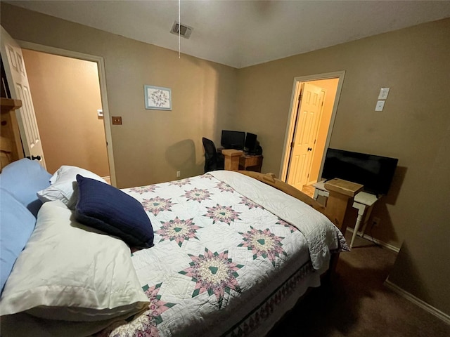 carpeted bedroom with visible vents and baseboards