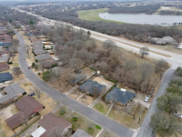 birds eye view of property with a residential view and a water view