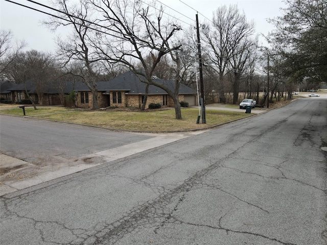 view of street with curbs