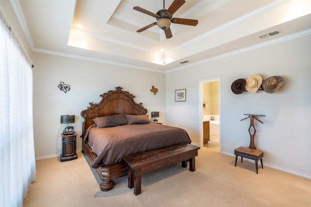 bedroom with baseboards, a tray ceiling, visible vents, and light colored carpet