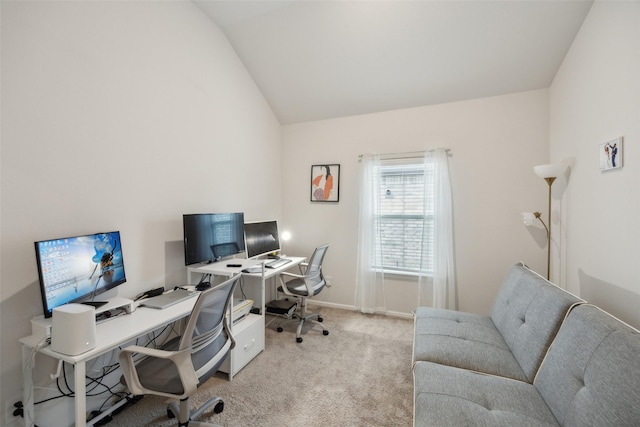 office featuring carpet, vaulted ceiling, and baseboards