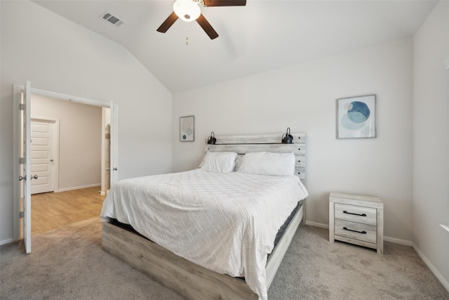 carpeted bedroom with lofted ceiling, ceiling fan, visible vents, and baseboards