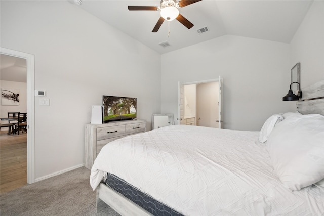 bedroom with vaulted ceiling, carpet flooring, visible vents, and baseboards