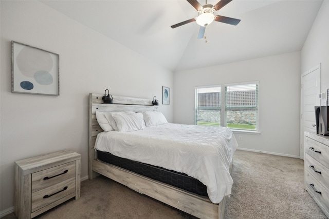 bedroom with a ceiling fan, lofted ceiling, light colored carpet, and baseboards