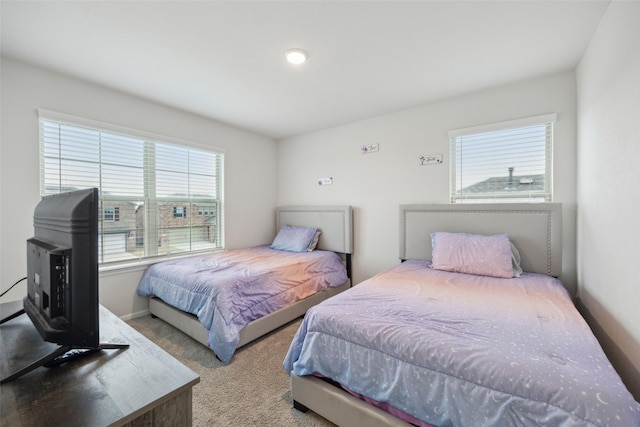 carpeted bedroom with baseboards