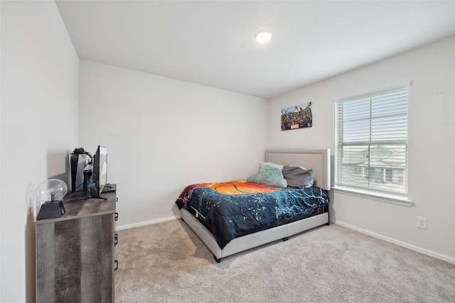 carpeted bedroom with baseboards