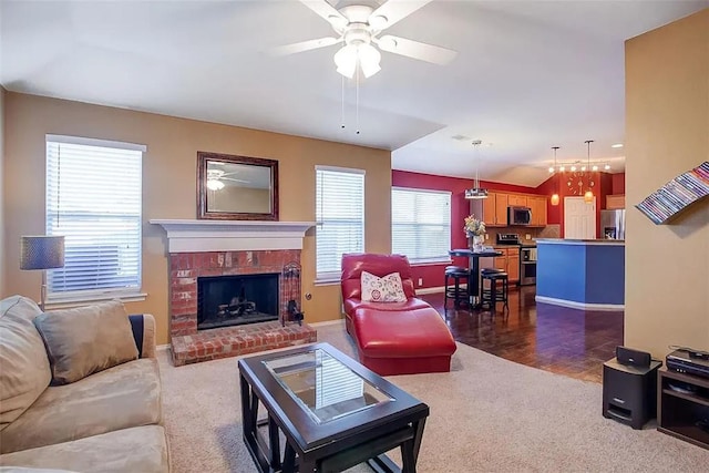 living area with ceiling fan, dark colored carpet, a brick fireplace, and baseboards