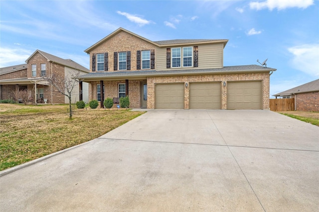 traditional home with concrete driveway, brick siding, and fence