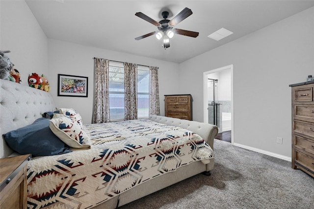 bedroom with a ceiling fan, baseboards, carpet flooring, and ensuite bathroom