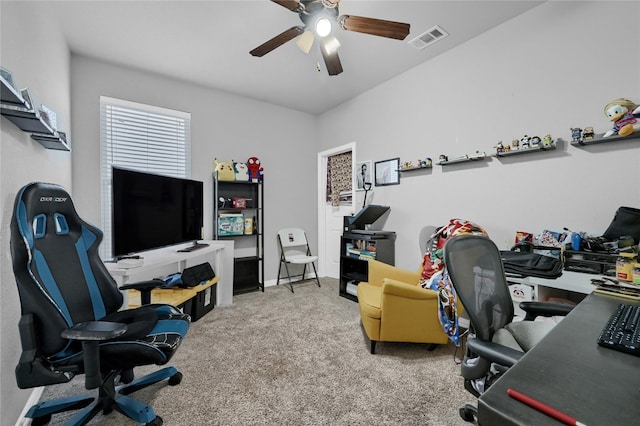 home office with carpet, visible vents, ceiling fan, and baseboards