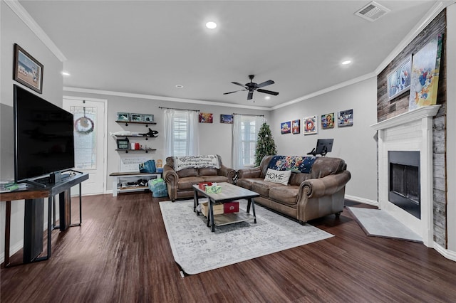 living room with crown molding, visible vents, and dark wood-type flooring