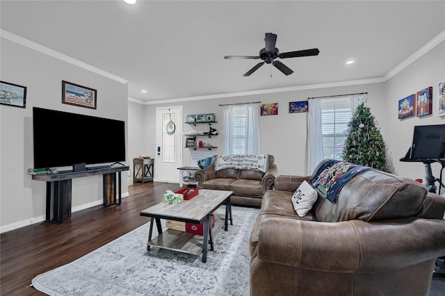 living room with baseboards, ceiling fan, wood finished floors, and crown molding