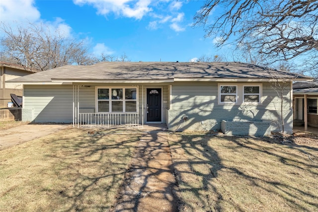 single story home with a porch and a front lawn