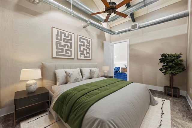 carpeted bedroom featuring baseboards, visible vents, a ceiling fan, a textured wall, and a high ceiling