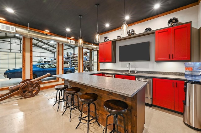 kitchen with finished concrete floors, a sink, visible vents, dishwasher, and pendant lighting