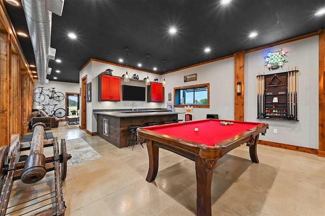 rec room with finished concrete flooring, baseboards, ornamental molding, and recessed lighting