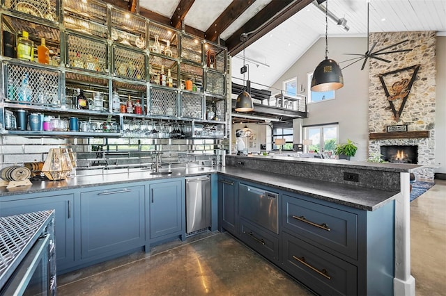 bar with a fireplace, high vaulted ceiling, pendant lighting, and concrete flooring