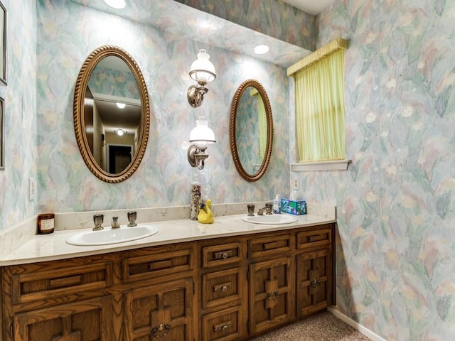 full bathroom with a sink and wallpapered walls