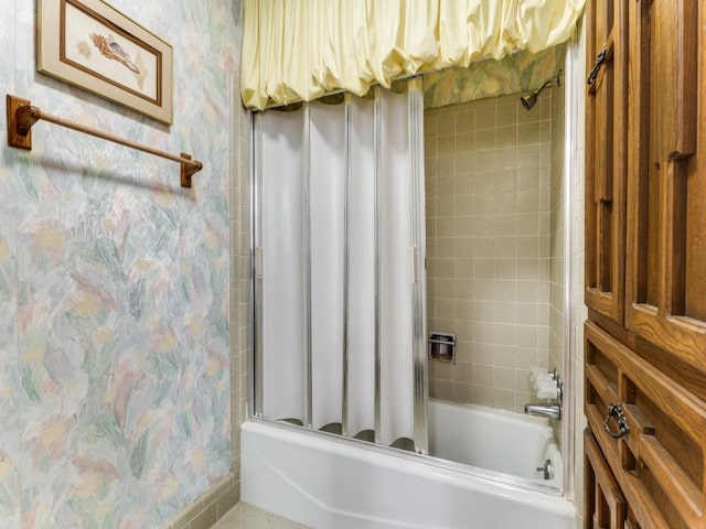 full bath featuring shower / tub combo and wallpapered walls