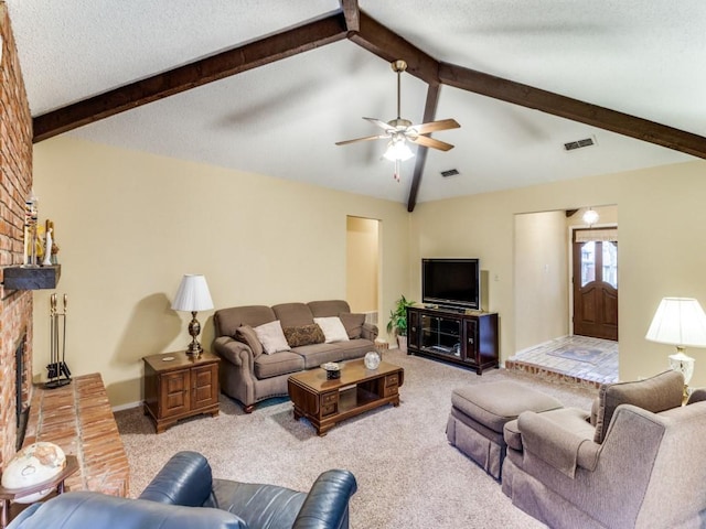 living room with carpet floors, a fireplace, and visible vents