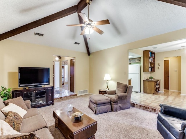 living room featuring carpet floors, visible vents, ceiling fan, and lofted ceiling with beams