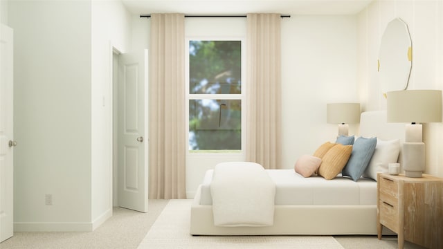 bedroom with carpet flooring and baseboards