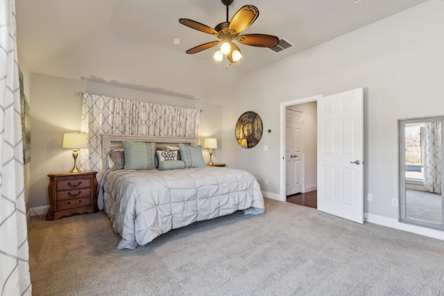 carpeted bedroom with visible vents, a ceiling fan, baseboards, and vaulted ceiling