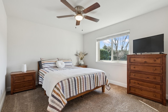 carpeted bedroom with baseboards and a ceiling fan