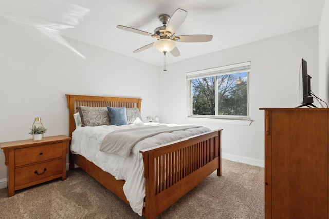 bedroom with carpet, baseboards, and ceiling fan