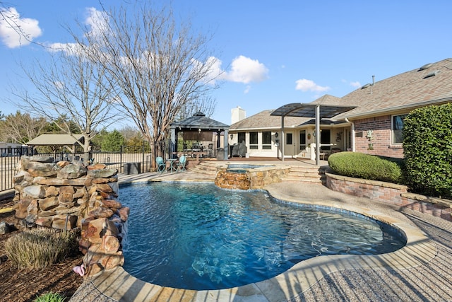 view of pool with fence, a gazebo, a fenced in pool, an in ground hot tub, and a patio area